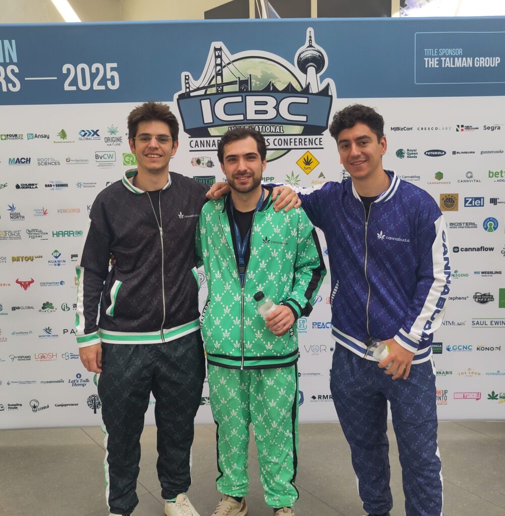 Cannabud.ai team - Guilherme Tavares (CEO on the left), Vítor Barreto (Head of Sales) in the middle, André Barbosa (CTO) on the right. All wearing cannabud.ai themed custom tracksuits